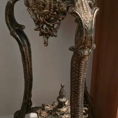 Sale Photo Thumbnail #85: Ornate Victorian Revival ornate cast metal plant stand featuring cabriole legs, relief details, and an antiqued gold finish.