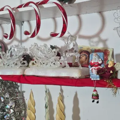 Sale Photo Thumbnail #33: Collection of Christmas decorations including plastic candy cane pathway markers, clear molded plastic sleigh and reindeer displays, and a vintage toy soldier doll.