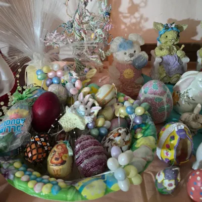 Sale Photo Thumbnail #24: Collection of spring and Easter decor, including decorated eggs, bunny figurines, and a pastel fiber-optic tree display.