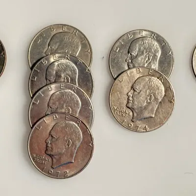 Lot of 8 Eisenhower Dollar Coins - Date Range 1971 - 1976