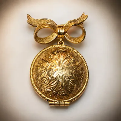 Vintage Gold-Tone Bow Brooch with Ornate Floral Engraved Solid Perfume Compact - Potterville