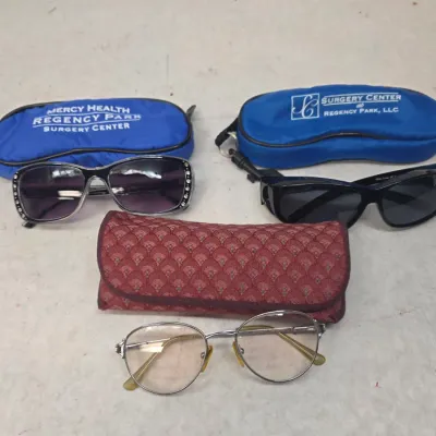 Pair of Post Surgery Sunglasses, Bifocal Sunglasses, and Trifocal Glasses