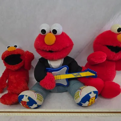 Vintage Rock & Roll Elmo, Vintage Tickle Me Elmo, and Vintage Plush Elmo