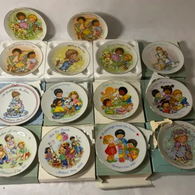 Set of 14 Avon Mini Display Plates