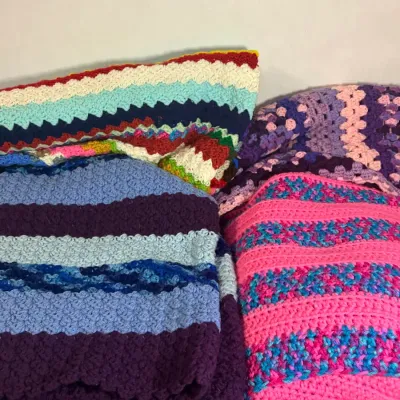 Multiple Different Crocheted Squares and Rectangle Blanket