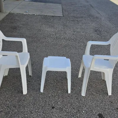 Pair of Outdoor Hard Plastic Chairs and Matching Table