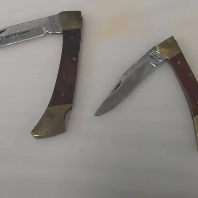 Pair of Wood and Brass Pocket Knives - One Mustang