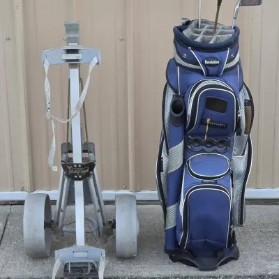 Revelation Golf Bag with Clubs and Fold-Up Bag Carrier on Wheels