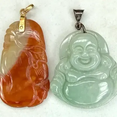 Sale Photo Thumbnail #110: Two Hand Carved Stone Pendants