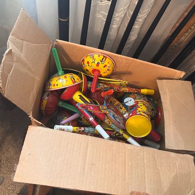Sale Photo Thumbnail #24: Collection of vintage lithographed tin party noisemakers and horns.