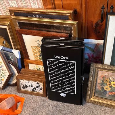 Sale Photo Thumbnail #135: Collection of framed artwork, vintage wall art, a hexagonal floral clock, and an Artis Orbis box set.