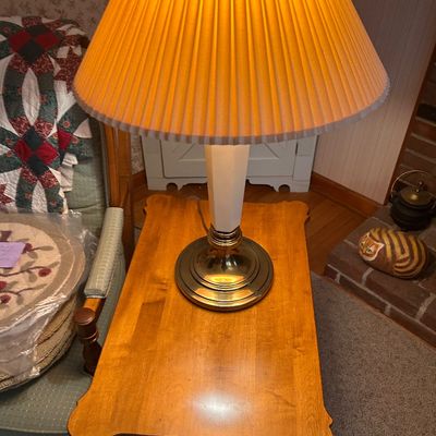 Sale Photo Thumbnail #130: Vintage table lamp with a pleated fabric shade and white faceted body on a brass base.