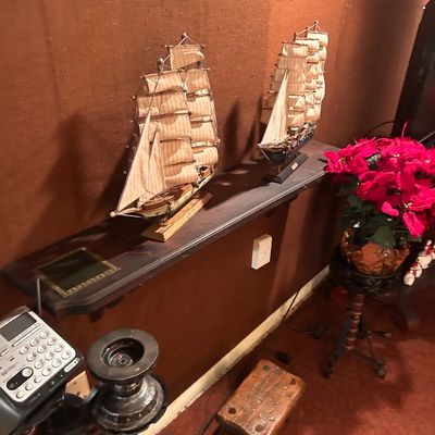 Sale Photo Thumbnail #69: Pair of detailed model sailing ships featuring fabric sails and wooden bases.