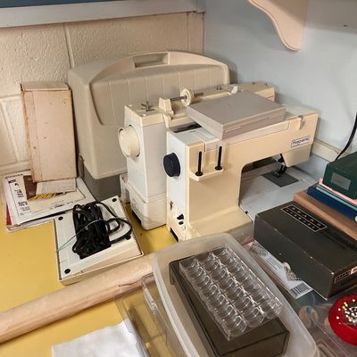 Sale Photo Thumbnail #38: Vintage Husqvarna sewing machine with hard case, foot pedal, and sewing accessories.