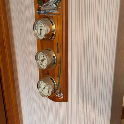 Sale Photo Thumbnail #115: Vintage wooden wall weather station featuring a painted mallard duck motif, thermometer, barometer, and hygrometer with brass-tone bezels.