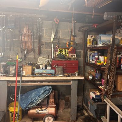 Sale Photo Thumbnail #18: Workshop tools, equipment, air compressor, red tool chest, shelving units, and various hardware accessories.
