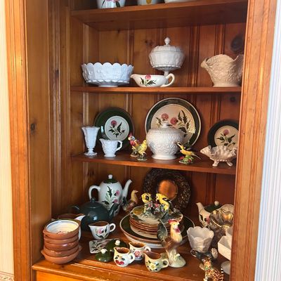 Sale Photo Thumbnail #137: Collection of vintage ceramics, milk glass glassware, floral-patterned china, teapots, and bird figurines.