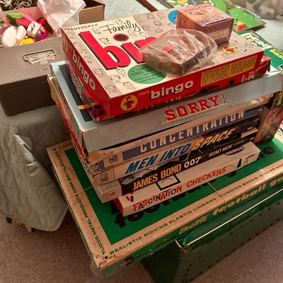 Sale Photo Thumbnail #111: Stack of vintage board games, including Transogram Family Bingo, Sorry!, Concentration, Men Into Space, and James Bond 007 Secret Agent Game.