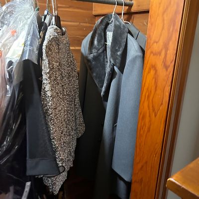 Sale Photo Thumbnail #87: Vintage men's grey overcoat with faux fur lapels alongside assorted formal women's outerwear.