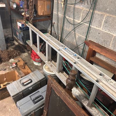 Sale Photo Thumbnail #17: Werner aluminum extension ladder alongside two plastic toolboxes and various workshop items.
