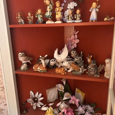 Sale Photo Thumbnail #127: Collection of decorative porcelain figurines, including angels, forest animals, birds, and floral accents.