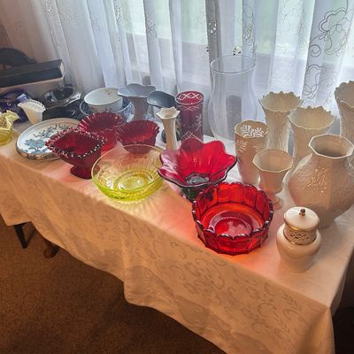 Sale Photo Thumbnail #136: Collection of vintage glass and porcelain glassware, including ruby red glass bowls, yellow depression glass, milk glass vases, and patterned ceramics.