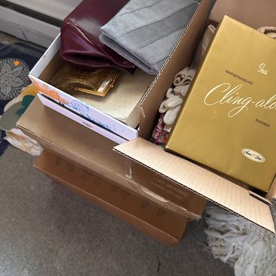 Sale Photo Thumbnail #79: Collection of vintage women's accessories including leather and suede clutch purses, vintage white gloves, and boxed Sears Cling-alon hosiery.