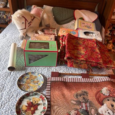 Sale Photo Thumbnail #107: Collection of teddy bear themed decor and collectibles, including decorative plates, a woven wall hanging, boxed items, linens, and a large plush horse.