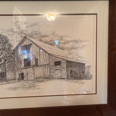 Sale Photo Thumbnail #120: Framed and matted pencil sketch print depicting a rustic barn, signed and numbered in the margin.