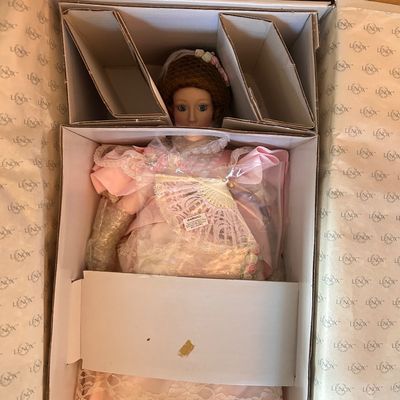 Sale Photo Thumbnail #93: Lenox porcelain doll in an ornate pink lace Victorian-style gown with a fan accessory.