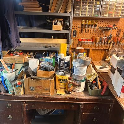 Sale Photo Thumbnail #54: Vintage executive wooden desk with multi-drawer storage and metal drop handles.