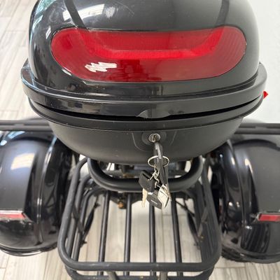 Sale Photo Thumbnail #441: This is known as the Shansu CP-3, or CityCoCo Trike Variant. It has  high-torque differential brushless motor setup. It has an estimated range of 25-35 miles with a full charge, and can reach speeds of 25-30mph. Includes charger, an extra set of keys, and