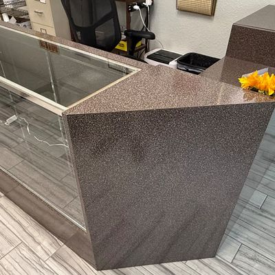 Sale Photo Thumbnail #427: This modular unit consists of a desk with a drawer and shelves, and a glass display counter with internal glass shelving and two drawers. It has a Formica style finish. There is age related wear. Contents are not included. Measurement: 73” x 84.5” (di