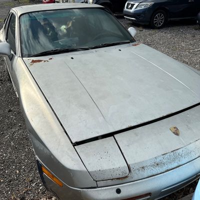 Sale Photo Thumbnail #448: This two-door car is blue in color. It was in the process of restoration, and is not currently running. Vehicle was running when parked.  Mechanic believes that fuel has crystallized in the system.  138,904 miles.  VIN: WP0AA0952GN152844. THE BUYER WILL N