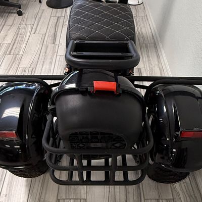 Sale Photo Thumbnail #436: This is known as the Shansu CP-3, or CityCoCo Trike Variant. It has  high-torque differential brushless motor setup. It has an estimated range of 25-35 miles with a full charge, and can reach speeds of 25-30mph. Includes charger, an extra set of keys, and