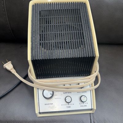 Sale Photo Thumbnail #78: Vintage Marsona 1200 sound conditioner / white noise machine featuring sound selection controls for Surf, Rain, and Waterfall, along with Surf Rate, Surf Range, Tone, and Volume dials. Molded plastic housing in off-white/cream with a black front grille. S