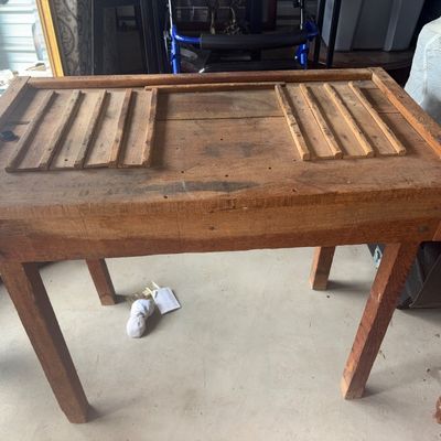 Sale Photo Thumbnail #67: 40X33.5X31in. Rustic antique rustic wooden workbench or cobbler/typesetter table featuring slatted sections on the top surface. Solid wood construction with straight square legs. Shows authentic age-appropriate wear, distressing, marks, and patina through