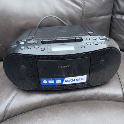 Sale Photo Thumbnail #59: Sony CFD-S50 portable boombox featuring a CD player, AM/FM radio, cassette recorder/player, and Mega Bass boost. Shows some surface dust and light cosmetic wear from use. Power cord included.