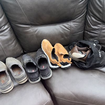 Sale Photo Thumbnail #77: Sizes 10.5 
Collection of men's casual and athletic shoes including slip-ons, sneakers, outdoor slip-on shoes, and brown athletic/golf shoes, accompanied by a black drawstring shoe bag. Shows visible signs of pre-owned wear and light dirt.