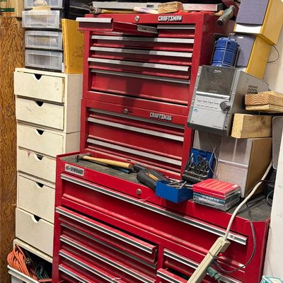 Sale Photo Thumbnail #33: Large red US General rolling tool chest combo with stacked Craftsman toolboxes, filled with assorted hand tools, hardware, and workshop supplies.