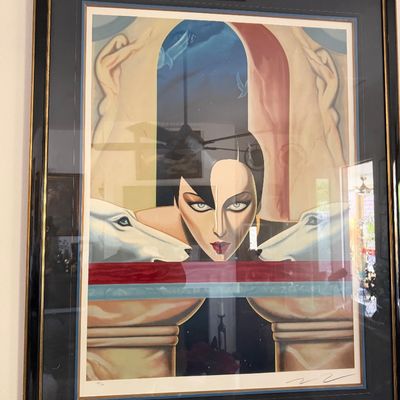 Sale Photo Thumbnail #7: Framed Art Deco style limited edition print featuring a woman's portrait flanked by white dogs, pencil signed and numbered in a black and gold frame.