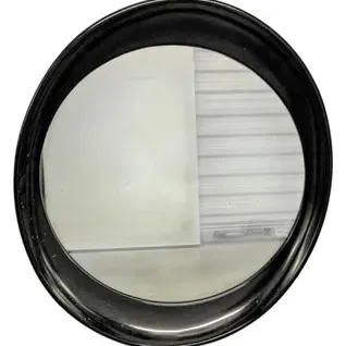 Round wall mirror with a thick, glossy black molded frame.