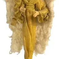 Standing angel figurine featuring a gold fabric gown, large feathered wings, and a halo mounted on a small black base.
