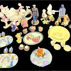 Collection of decorative porcelain and ceramic collectibles, including figurines, miniature tea sets, bird-themed trays, and a large...