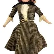 Antique bisque head doll dressed in a striped Victorian-style ensemble with a red bonnet and black button boots.