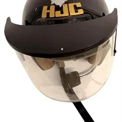 Black HJC open-face motorcycle helmet featuring a clear face shield and front sun visor peak, showing light wear and scuffing on the top...