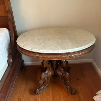 Antique Victorian Marble Top Oval Parlor Table with Ornately Carved Walnut Base & Casters