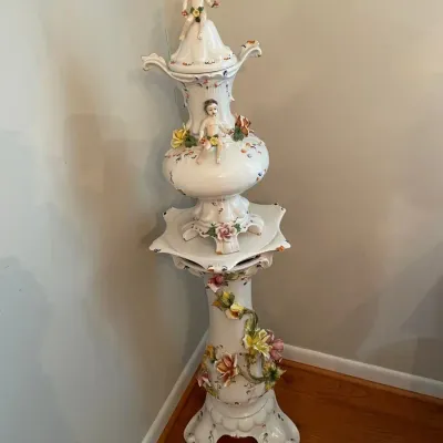 Ornate Porcelain Cherub Covered Urn & Floral Pedestal Stand – 2 Pieces