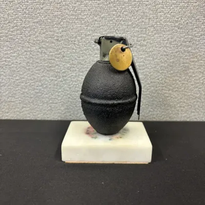 Vintage Inert Hand Grenade On Stone Slab