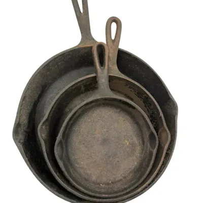 Three Cast Iron Pans 11”, 8.5”, 7 “